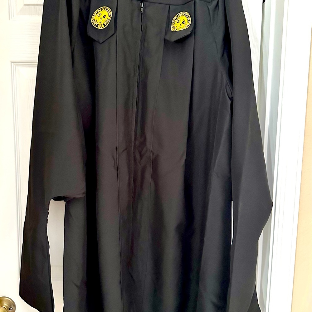 University of South Florida Master’s graduation gown, mortar board, and hood